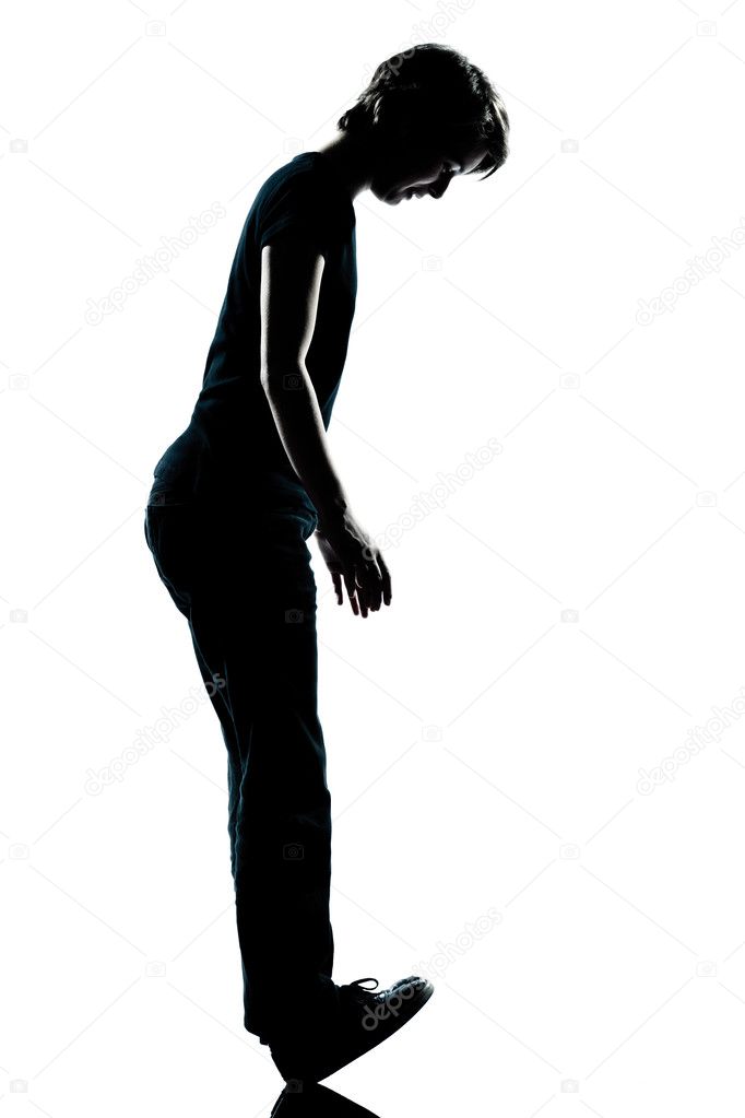 One young teenager boy or gir standing balancing on heels silhou
