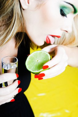 Woman drinking Tequilla clipart