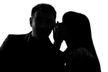 One couple man and woman whispering at ear clipart