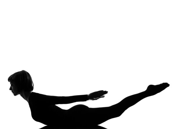 Woman salabhasana Locust Pose yoga grasshopper posture position in silouhette on studio white background full length
