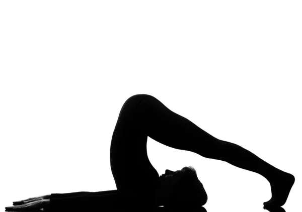 Woman halasana Shoulder Stand yoga pose — Stock Photo, Image