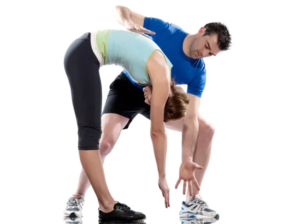 Muž aerobní trenér umístění žena cvičení — Stock fotografie