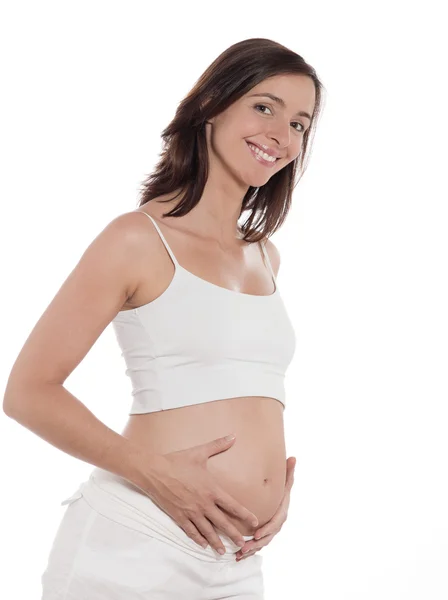 Улыбка портрета беременной женщины — стоковое фото