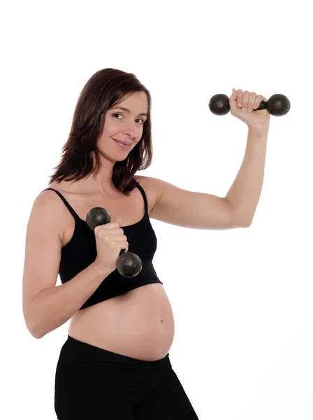 Kobieta w ciąży treningu z hantle — Zdjęcie stockowe