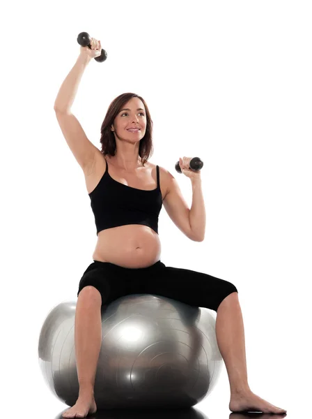 Kobieta w ciąży treningu siłowego siedzi na siłowni — Zdjęcie stockowe