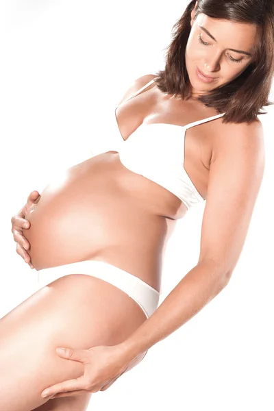 Pregnant woman pinching cellulite — Stock Photo, Image