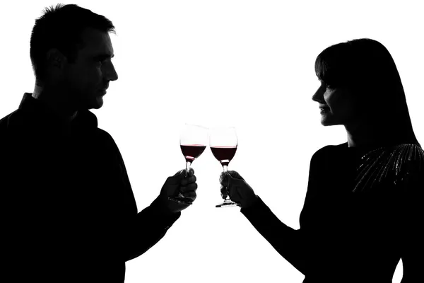Egy pár férfi és a nő iszik, vörös bor pirítás — Stock Fotó