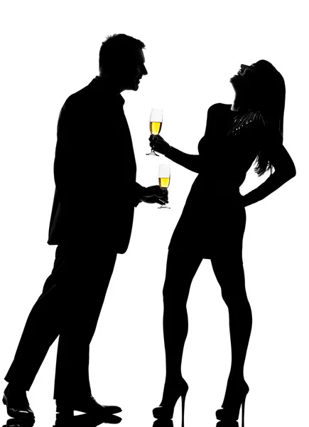 Silhouette couple man and woman drinking champagne partying — Stock Photo, Image