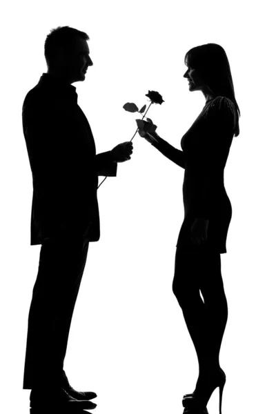One couple man offering rose flower and woman smiling — Stock Photo, Image