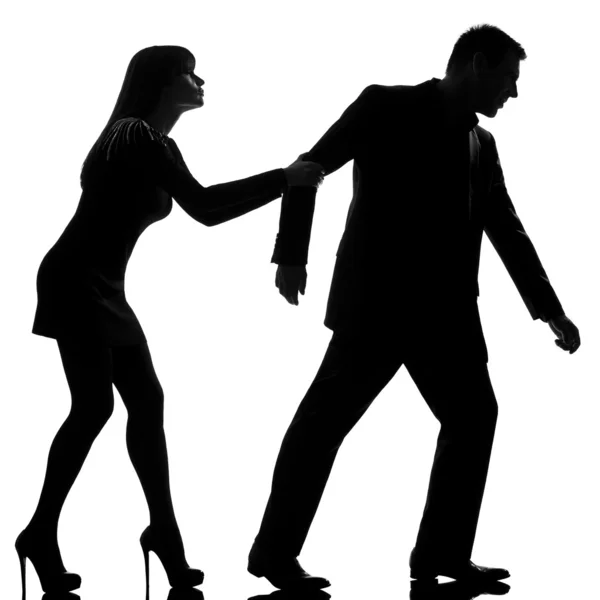 One couple dispute separation man leaving and woman holding back — Stock Photo, Image
