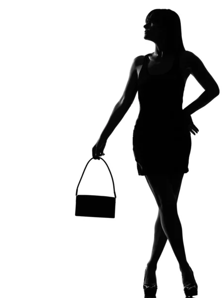 Élégante silhouette femme attente tenant sac à main — Photo