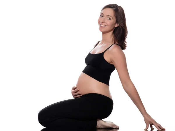 怀孕的女人坐在开朗 免版税图库照片