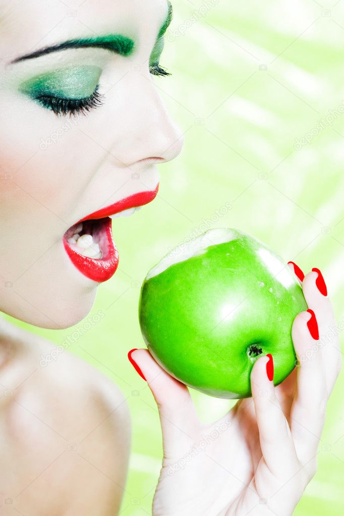 Woman portrait eat an apple