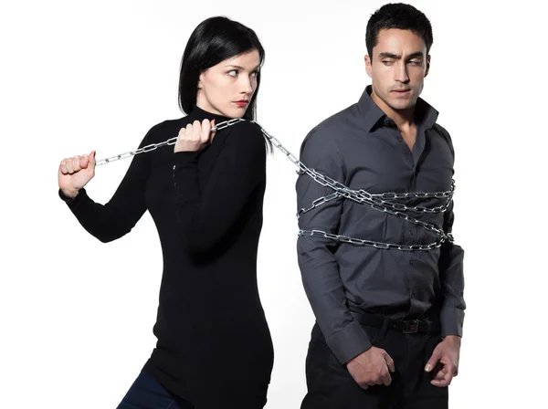 Woman restraining a man chained — Stock Photo, Image