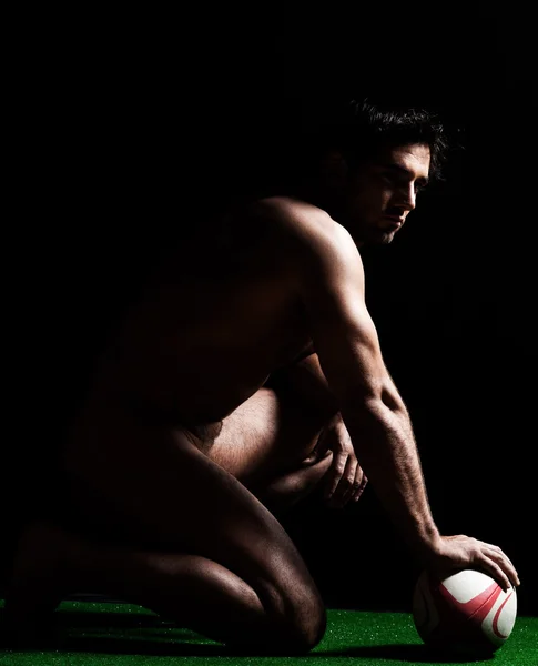 Sexy naked rugbyman kneeling — Stock Photo, Image