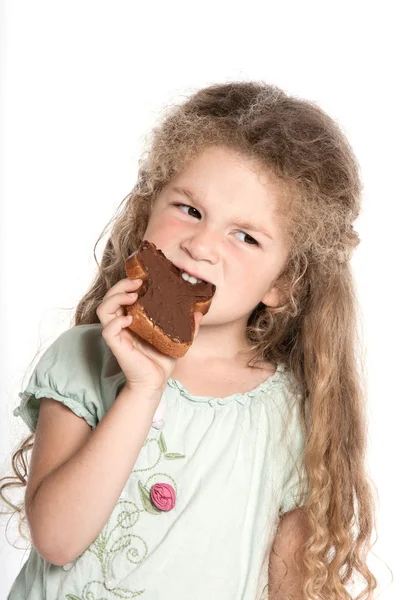 Little girl portrait eating chocolate spread — Stock Photo, Image
