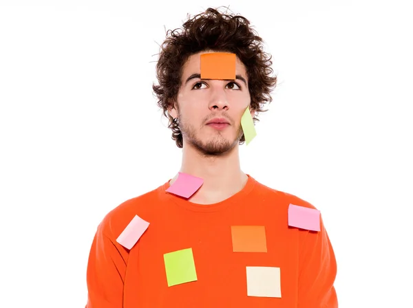 One young man portrait covered by adhesive notes Stock Photo
