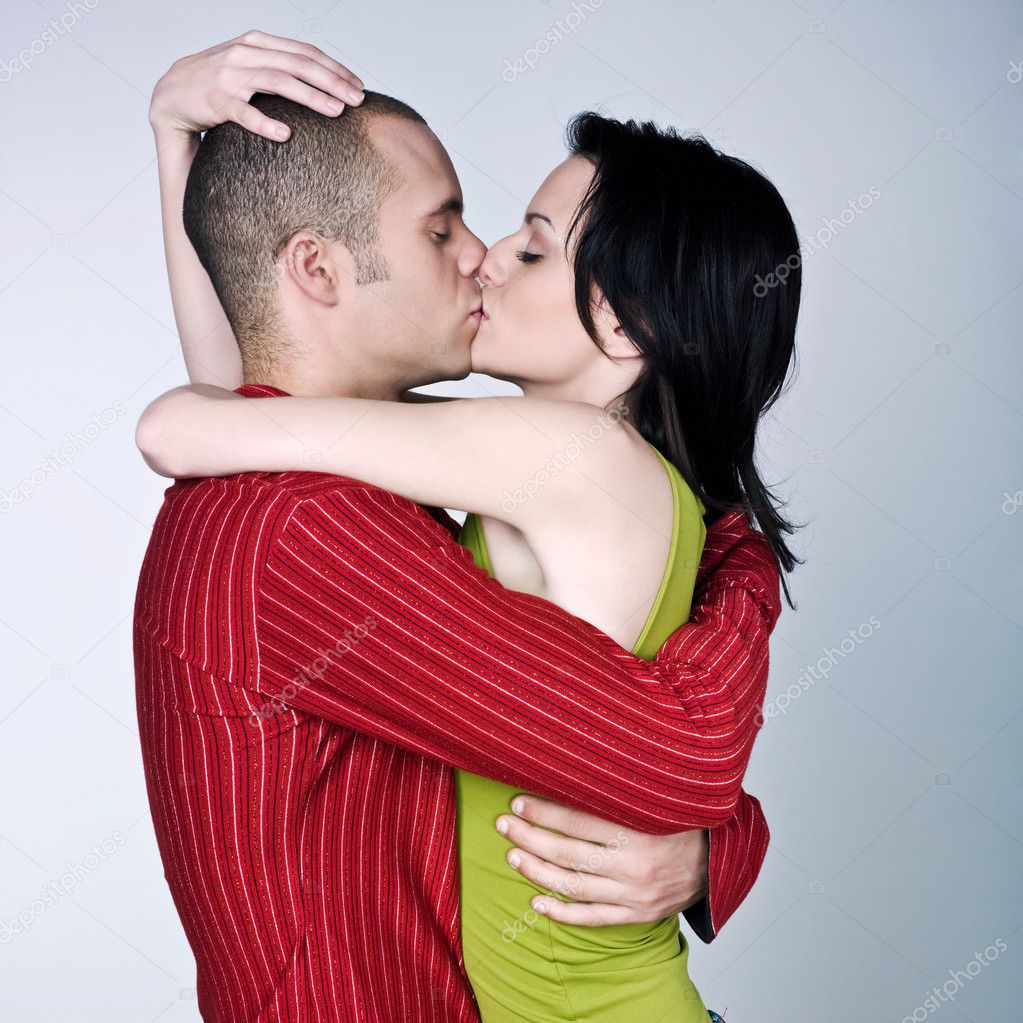 Young couple hugging kissing