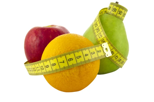 Frutta fresca con un nastro di misurazione — Foto Stock