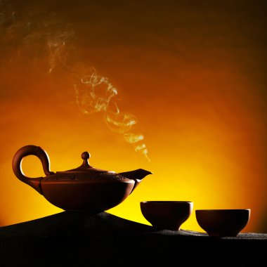 Old arabian ceramic teapot with teacaps clipart