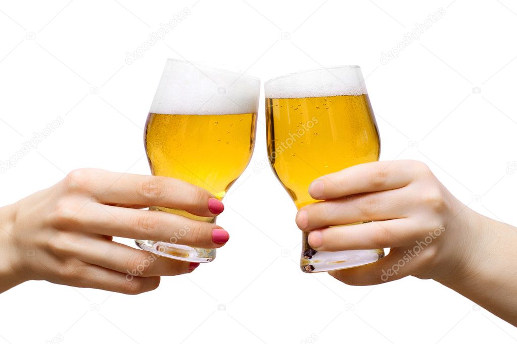 Two arms with glasses of beer isolated on white