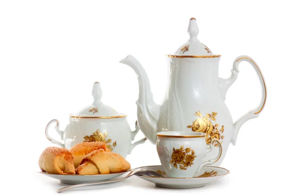 Coffee pot with cup and saucer of cakes — Stock Photo, Image