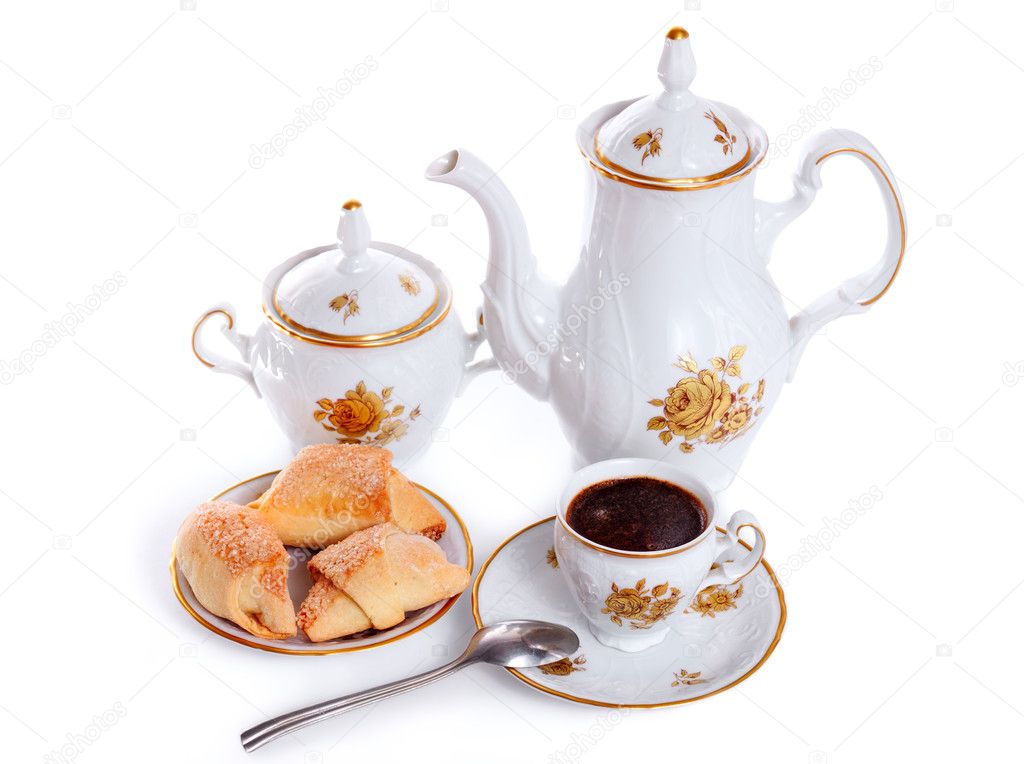 Coffee pot with cup and saucer of cakes