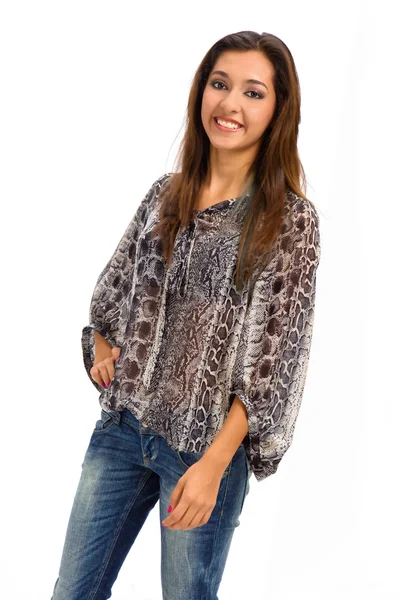 Portrait of a stunning young woman posing in jeans and animal print blouse — Stock Photo, Image