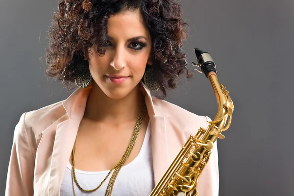 stock image Beautiful Girl with Saxophone on Grey Background