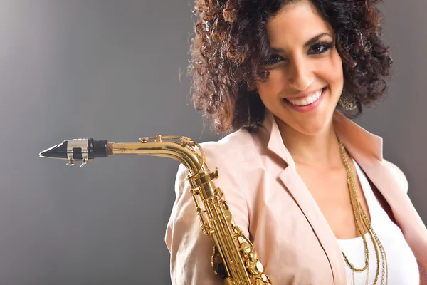 stock image Beautiful Girl with Saxophone on Grey Background