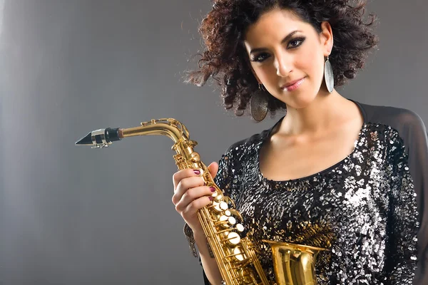 stock image Beautiful Girl with Saxophone on Grey Background