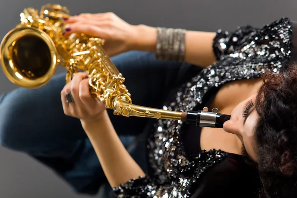 stock image Beautiful Girl with Saxophone on Grey Background