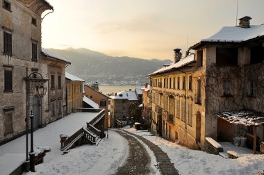 The beautiful staircase of Orta St. Julian in one snowy sunset clipart