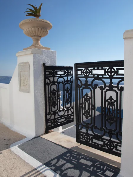 stock image Gate and vase with sea view