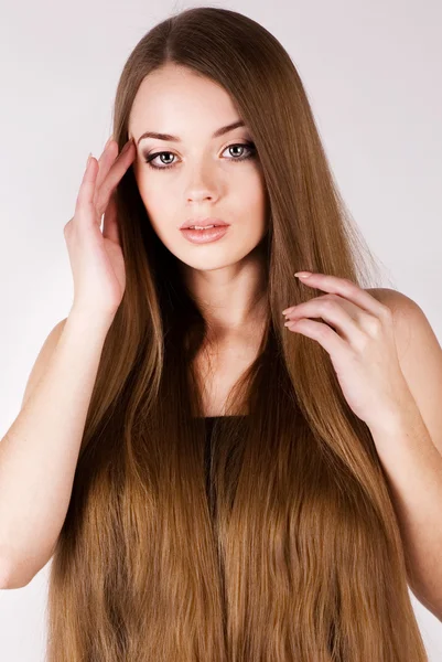 stock image A beautiful young girl with a long hair
