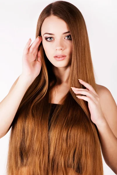 Egy szép fiatal lány hosszú hajjal Jogdíjmentes Stock Képek