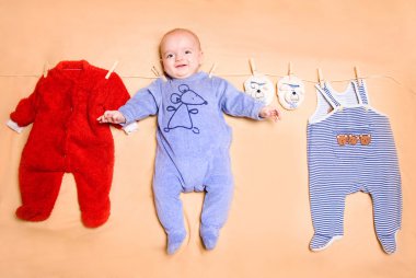 Little cute baby with clothes clipart