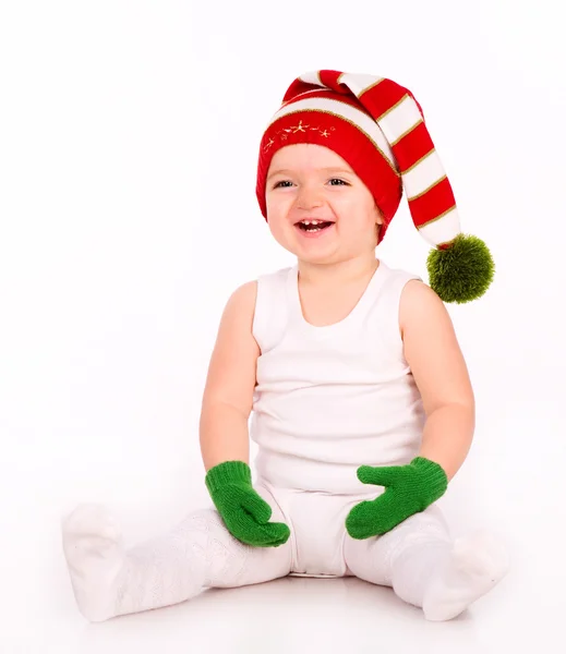 Cute baby playing in a hat and mittens — Stock Photo, Image