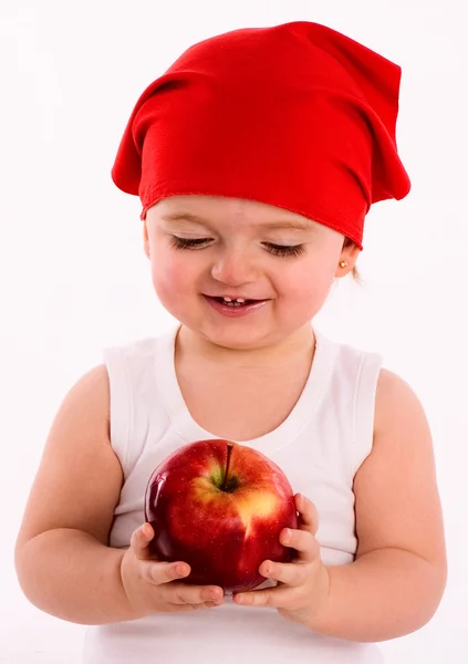 Pretty nice little girl. Close-up in the studio with apple — Stock Photo, Image