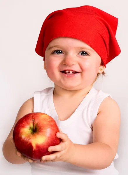 Pretty nice little girl. Close-up in the studio with apple — Stock Photo, Image