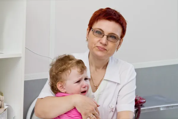 stock image Baby on her lap doctor