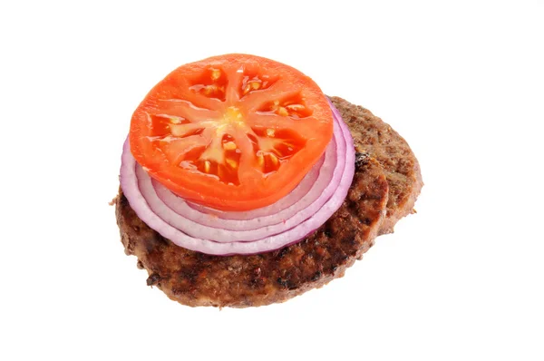 Grilled hamburger patty with onion and tomato — Stock Photo, Image