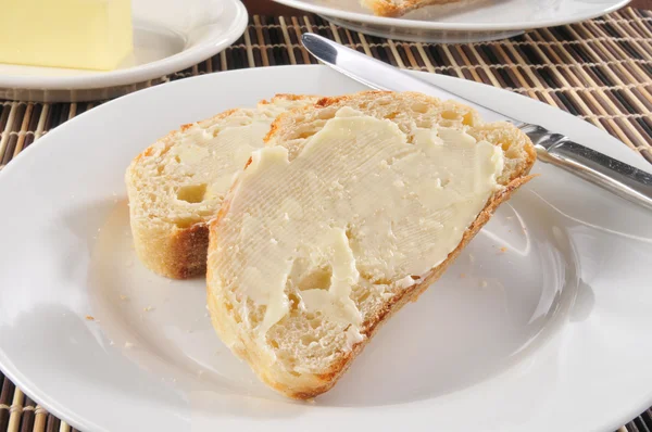 stock image Buttered bread