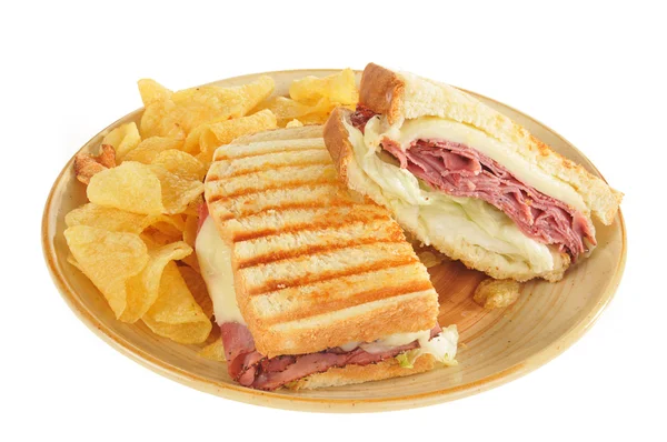Grilled roast beef and panini sandwich and chips — Stock Photo, Image