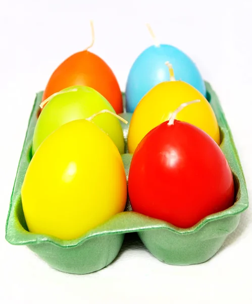 Easter candle in egg form in the box on a white background — Stock Photo, Image