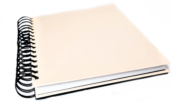 Svart rosa spiral notebook över vita — Stockfoto