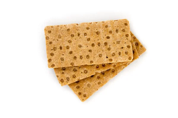 Drei braune Cracker auf weißem Hintergrund, Diät — Stockfoto