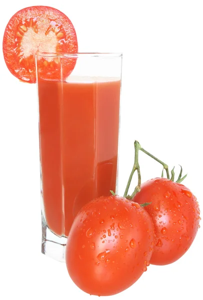 Стакан томатного сока и два помидора . — стоковое фото