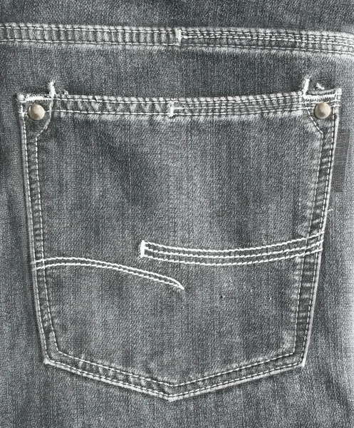 Bolso traseiro de calça jeans preta close-up — Fotografia de Stock