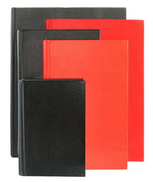 Cinque libri rossi e neri uno di fronte all'altro — Foto Stock